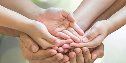 Family hands praying together (clipping path) for donation charity concept
